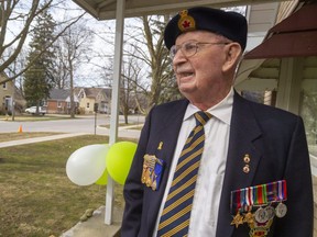 Friends and family of Murray Greene didn't wait for the official drive-by parade Tuesday night to celebrate his 100th birthday. People driving by his home in Exeter during the day honked when they saw the balloons and the 100 year old signs, his family said. After serving in the Canadian Army during the Second World War, Greene and his wife operated a variety store and he chaired the public utility commission for 30 years. (Mike Hensen/The London Free Press)