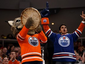 Edmonton Oilers mascot Hunter revs up the crowd versus San Jose Sharks during the third period of a NHL game at Rogers Place in Edmonton, on Saturday, Feb. 9, 2019.  A 50-page document has been submitted by the Oilers Entertainment Group to Alberta Health Services seeking permission to become the first pro sports team in Canada to allow fans back in the stands.
