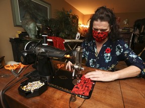 Kelly "the Mask Lady" Petroff makes poppy masks for Remembrance Day on Tuesday, November 3, 2020.