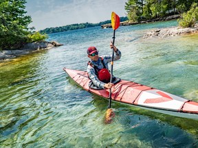 A kayaker on the water at Thousand Islands.