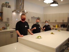 REACH Centre Grey-Bruce participants, from left to right, Matthew Poste, Lachlan MacArthur and Amanda Smit stand in the accessible teaching kitchen in the organization's new “forever home” at 369 8th St. E. in Owen Sound. The newly renovated building opened for programming March 15. DENIS LANGLOIS