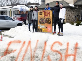 With the support of friends Carly Wouters (left), Brooklyn MacLean, Dave Chessell and Avery Wedow (right), Tom Rowland completed a gruelling 4x4x48 Challenge March 5-7. He ran four miles every four hours for a 48-hour span - or 48-miles (77-kilometres), to raise money for youth mental health and the Tanner Steffler Foundation. MacLean also ran every time with Rowland, with others joining in on roller blades, bikes or walk to give moral support. ANDY BADER/MITCHELL ADVOCATE