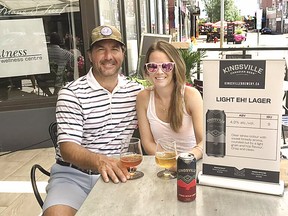 Retired National Hockey League goalie Marty Turco and his wife Kelly enjoy a cold Kingsville Brewery product at Mane St. patio bar in the Sault's downtown. Marty and Kelly are both from Sault Ste. Marie and they maintain a residence here with their three kids. Marty is also a part owner of Kingsville Brewery. MARY DESIMONE