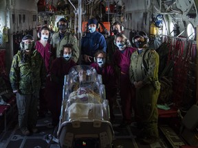 Members of the Canadian Armed Forces' (CAF) Aeromedical Evacuation Flight Unit train with an EpiShuttle during a flight on Nov. 19, 2020, at Canadian Forces Base Trenton in Trenton, Ont.   Photo by Pte. Natasha Punt.