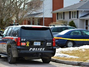 Belleville Police remained Thursday at the home where police discovered of a dead woman Tuesday leading to first-degree murder charges of a male. No names have been released pending notification of next of kin. DEREK BALDWIN