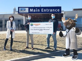 QHC President and CEO Stacey Daub, Belleville General Hospital Fondation Executive Director Steve Cook accepted a $150,000 gift from Pioneer Health CEO Travis Shawcross, with BGHF mascot Dr. Max the Medical Moose providing support. SUBMITTED PHOTO