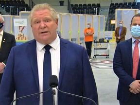 Premier Doug Ford pledged to fix hiccups in a newly rolled out vaccine booking system while he visited a new mass vaccination centre in Cobourg Monday afternoon flanked by Dave Piccini, MPP for Northumberland-Peterborough South, right, and Cobourg Mayor John Henderson. YOUTUBE