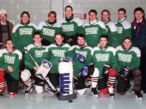 Dennis Duce (back, right) has been coaching hockey in the city for 50 consecutive years. Duce is shown here with a Brantford Minor Hockey Association midget/juvenile team that included his son, Adam (back, fourth from left).