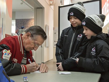 Walter Gretzky signs autographs for Ancaster Avalanche players Braden Giovannangeli, age 11 (centre) and his eight-year-old brother Nathan on Wednesday December 28, 2016 at the Wayne Gretzky Sports Centre in Brantford, Ontario. Canada's Greatest Hockey Dad spends hours each day meeting players participating in the 47th annual Wayne Gretzky International Hockey Tournament. Brian Thompson/Brantford Expositor/Postmedia Network