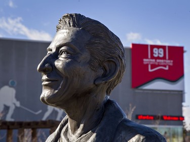 A statue of Walter Gretzky stands outside the Wayne Gretzky Sports Centre in Brantford, Ontario. With it is one of his wife Phyllis, and Wayne Gretzky as a youngster, looking up at a larger statue of Wayne Gretzky hoisting the Stanley Cup over his head. Walter Gretzky passed away Thursday at his Brantford home at the age of 82. Brian Thompson/Brantford Expositor/Postmedia Network