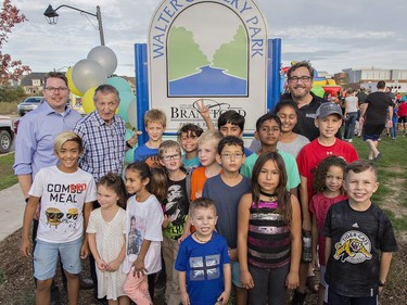 Walter Gretzky is joined by Ward 1 city councillor Rick Weaver (left) Brantford mayor Chris Friel and plenty of children Wednesday afternoon October 10, 2018 for the official opening of a new park named after him behind St. Basil/Walter Gretzky School in Brantford, Ontario.Brian Thompson/Brantford Expositor/Postmedia Network