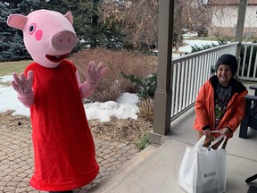 Weston Kukielka recieves a delivery from Peppa Pig as part of the 14th annual Storybook fundraiser on March 6 for Kids Can Fly.