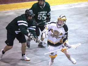 Brantford Warriors player Max Lewis (white) battles a Fergus Thistles player during the 2019 Ontario Lacrosse Association junior C season. The 2021 season is up in the air.
