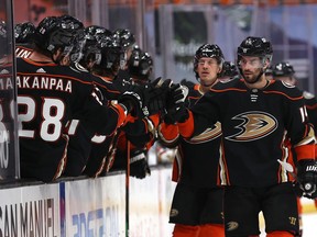 Adam Henrique of the Anaheim Ducks  is congratulated at the bench after scoring a goal against the Vegas Golden Knights.