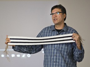 Rick Monture, shown holding a Two Row wampum belt, is a Mohawk from Six Nations and professor of Indigenous studies at McMaster University. Expositor file photo