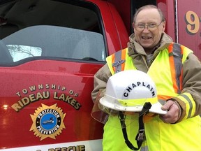 Father Thomas Dorward received his white helmet for his role as Fire Chaplain for the Rideau Lakes Fire Department last week. (SUBMITTED PHOTO COURTESY OF SCOTT GRANAHAN)