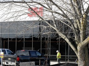 A worker walks by the front of the expanded 3M Canada site in Brockville. (File)