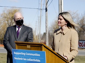 Jill Dunlop, Ontario's associate minister of children and women's issues, joins Municipal Affairs Minister and MPP Steve Clark to announce funding for victims of human trafficking, in a media event at Brockville's police station on Friday morning. (RONALD ZAJAC/The Recorder and Times)