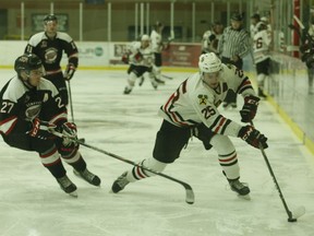 Nathan Merrett (left) of Kemptville tries to disrupt Ryan Gillespie as the brockville forward speeds into the 73's end at the Memorial Centre on Friday night. Gillespie scored a goal in the Braves' 4-3 scrimmage victory.
Tim Ruhnke/The Recorder and Times