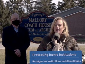 Ontario Minister of Heritage, Sport, Tourism and Culture Industries Lisa MacLeod speaks at an event Monday morning at the Mallory Coach House while Municipal Affairs Minister and local MPP Steve Clark listens. (SCREENSHOT)