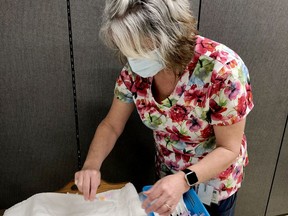 After a year marred by stress and fear, staffers are seeing a glimmer of hope as they start receiving their first shots. Here a BGH nurse prepares a batch of vaccines to be administered to colleagues. (SUBMITTED PHOTO)