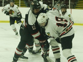 Cameron Cotnam (left) of Kemptville and Owen Belisle of Brockville take a face-off at the Memorial Centre on Friday night. In what was likely their final scrimmage of the season, the Braves defeated the 73's 4-2. The Memorial Centre arena will close Monday when Leeds, Grenville and Lanark enters the COVID-19 red zone.
Tim Ruhnke/The Recorder and Times