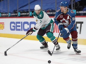 Ben Hutton (left) of Anaheim keeps tabs on Mikko Rantanen of Colorado during an NHL game in Denver last week. Matthew Stockman/Getty Images