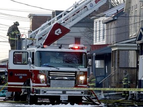 Brockville firefighters finish fighting a fire on Buell Street on Thursday morning, after dealing with the blaze overnight. (RONALD ZAJAC/The Recorder and Times)