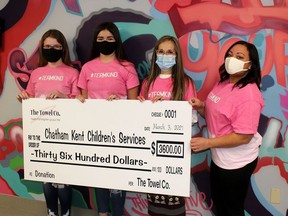 Ashley Sanderson, left, and Bailey Rickman, second left, sold #TeamKind t-shirts recently for Pink Shirt Day, raising $3,600 that has been donated to support two programs at Chatham-Kent Children's Services. The 13-year-old Dawn Euphemia residents presented a cheque to Teri Thomas-Vanos, CKCS executive director and Michelle Robbins, right, with the CKCS Foundation.