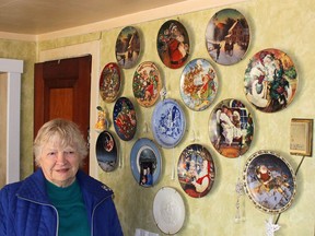 Joyce Bowls displays the many decorative plates she received as gifts over the years from residents in the Kent Bridge area who appreciated her service as a letter carrier. Ellwood Shreve/Postmedia Network