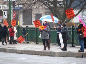 Several people braved the rain to take part in the Rally on the Bridge, held on the Third Street Bridge in Chatham on Nov. 25. This was the seventh year a rally to end violence against women has been organized by the Zonta Club of Chatham-Kent. Ellwood Shreve/Postmedia Network