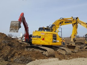 Crews are shown Tuesday at the site of a new industrial park planned for Park Avenue East and Sass Road in Chatham. Lots have been selling briskly at the private development. (Trevor Terfloth/The Daily News)