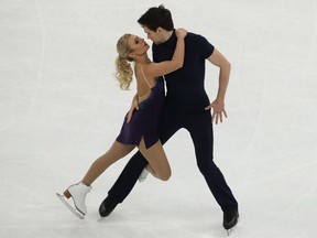 Kirsten Moore-Towers and Michael Marinaro of Canada perform in the pairs short program during the ISU world figure skating championships at Ericsson Globe on March 24, 2021, in Stockholm, Sweden. (Linnea Rheborg/Getty Images))