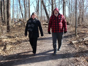 Helma Sterling, left, and her brother Ben Luiking, seen here Tuesday, were added to the count of people using the Rotary Eco-Trail by the Eco-Counter system that is providing real-time data on the number of visitors to the popular trail in north Chatham. (Ellwood Shreve/Chatham Daily News)