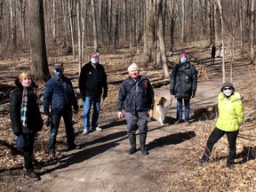 A group of local residents gathered at the O'Neill Nature Reserve - Rotary Eco Trail to remember and celebrate efforts that have saved the woodlot, which has become a popular for area residents to enjoy nature. Pictured from left are: Dianne Flook, with the Chatham-Kent Trails Council, Barry Fraser, with the Rotary Club of Chatham, Hans Van Leeuwen, Gary Eagleson and Dave Welton, members of the Preserve Paxton's Bush citizen committee, and Dr. Linda Sinnaeve. Ellwood Shreve/Chatham Daily News/Postmedia Network