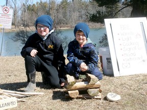 Cole and Owen Ulch of Dublin learned about the different types of fires at an event hosted by Huron and Area Search and Rescue at Morrison Dam on March 20-21. Scott Nixon