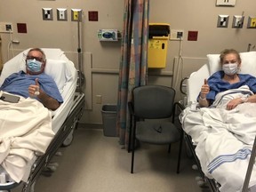 Bonnie O'Reilly and Graham Nesbitt give the thumbs up from their hospital beds at the London Health Sciences Centre's Transplant Unit. Handout