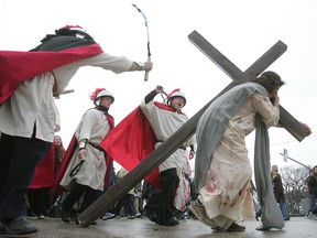 Actors recreate the crucifixion of Jesus Christ as part of the Public Way of the Cross hosted by Holy Ghost Church on Selkirk Avenue on Good Friday, April 2, 2010, in Winnipeg, Man.