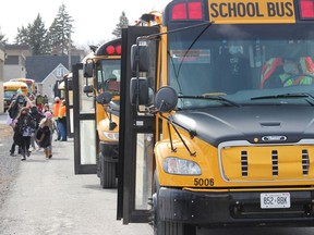 Students along the row of buses at La Citadelle on Friday, March 12, 2021, in Cornwall, Ont. Todd Hambleton/Cornwall Standard-Freeholder/Postmedia Network