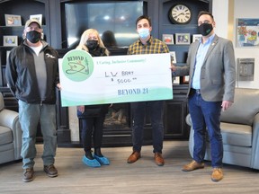 Stuart Thomson and business development manager Cory Houle (left) of Louis W. Bray Construction presented a $5,000 donation to Beyond 21's founder and board chair Tish Humphries and executive director Alex de Wit on Monday March 15, 2021 in Cornwall, Ont. Francis Racine/Cornwall Standard-Freeholder/Postmedia Network