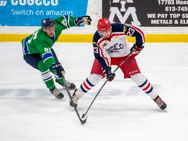 Cornwall Colts John Richer guards the puck from a poke from Hawkesbury Hawks Hugo Lecavalier during play on Friday March 5, 2021 in Cornwall, Ont. The Hawks won 4-2. Robert Lefebvre/Special to the Cornwall Standard-Freeholder/Postmedia Network