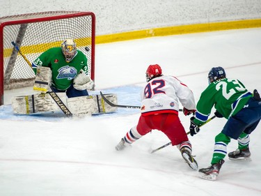 Cornwall Colts Brayden Bowen's shot bounces off Hawkesbury Hawks goaltender David O'Keefe's shoulder during play on Friday March 5, 2021 in Cornwall, Ont. The Hawks won 4-2. Robert Lefebvre/Special to the Cornwall Standard-Freeholder/Postmedia Network