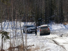 Wood Buffalo RCMP secure a trail, located near Silin Forest Road and Thicket Drive, on Sunday, March 21, 2021 after human remains were found in the area.  Sarah Williscraft/Fort McMurray Today/Postmedia Network