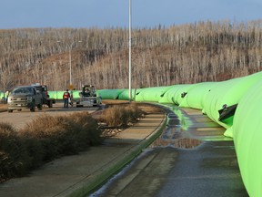 Water-filled portable dams line Clearwater Drive as part of the municipality's flood protection plan on Thursday, March 18, 2021. Sarah Williscraft/Fort McMurray Today/Postmedia Network