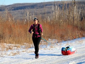 Jessica Leska finishes her four-day run, running to the Waterways dog park entrance on Monday, March 8, 2021. Laura Beamish/Fort McMurray Today/Postmedia Network