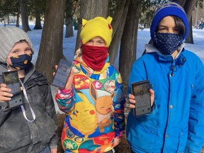 Adults and children took part in a Pokémon Go Community Day event, organized by the United Way of Bruce Grey, at Owen Sound's Harrison Park Saturday. Participants included, from left to right, Emerson Bryant, 7, Nelson MacLeod, 9, and Pascal Colaco, 10, who are each showing on their cell phones Pokémon they have captured in the augmented reality game. DENIS LANGLOIS