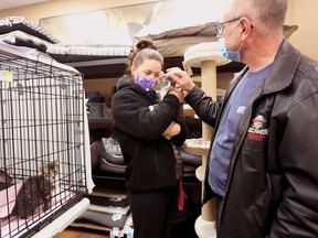 Dakota Weese holds the kitten that she and her dad, Doug, adopted on Sunday during a Napanee Community Kitten Rescue adoption event at Paulmac's Pets in Napanee on Sunday.