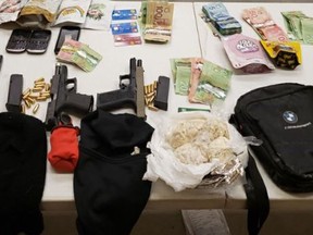 Two loaded firearms, a suppressor, a balaclava and gloves, high-capacity magazines, multiple cellphones, nearly 400 grams of suspected cocaine, bags of marijuana, more than $28,000 in cash, and drug paraphernalia were seized by Ontario Provincial Police in Napanee during a traffic stop on March 5.