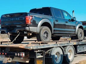 A stolen pickup truck was apprehended and the driver arrested following a police rolling block manoeuvre on Highway 401 in Loyalist Township on Friday.