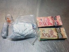 Fentanyl, cocaine, crystal methamphetamine and cash seized from a vehicle by Ontario Provincial Police on Monday night.